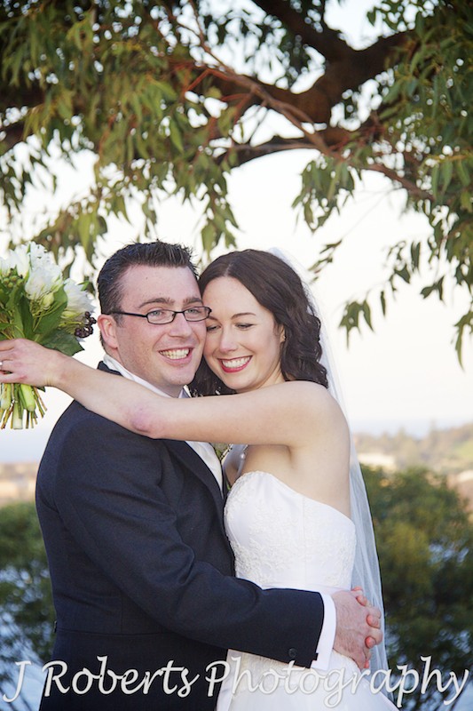 Bride and groom hugging at Georges Heights - wedding photography sydney